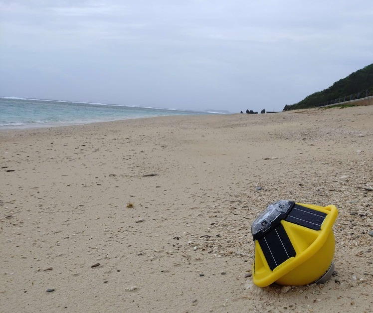 Yellow Spotter wave buoy beached on Tonaki Island after the Typhoon Saudel deployment